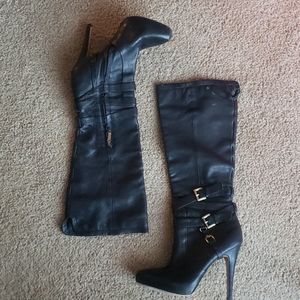 Knee high, high heeled boots